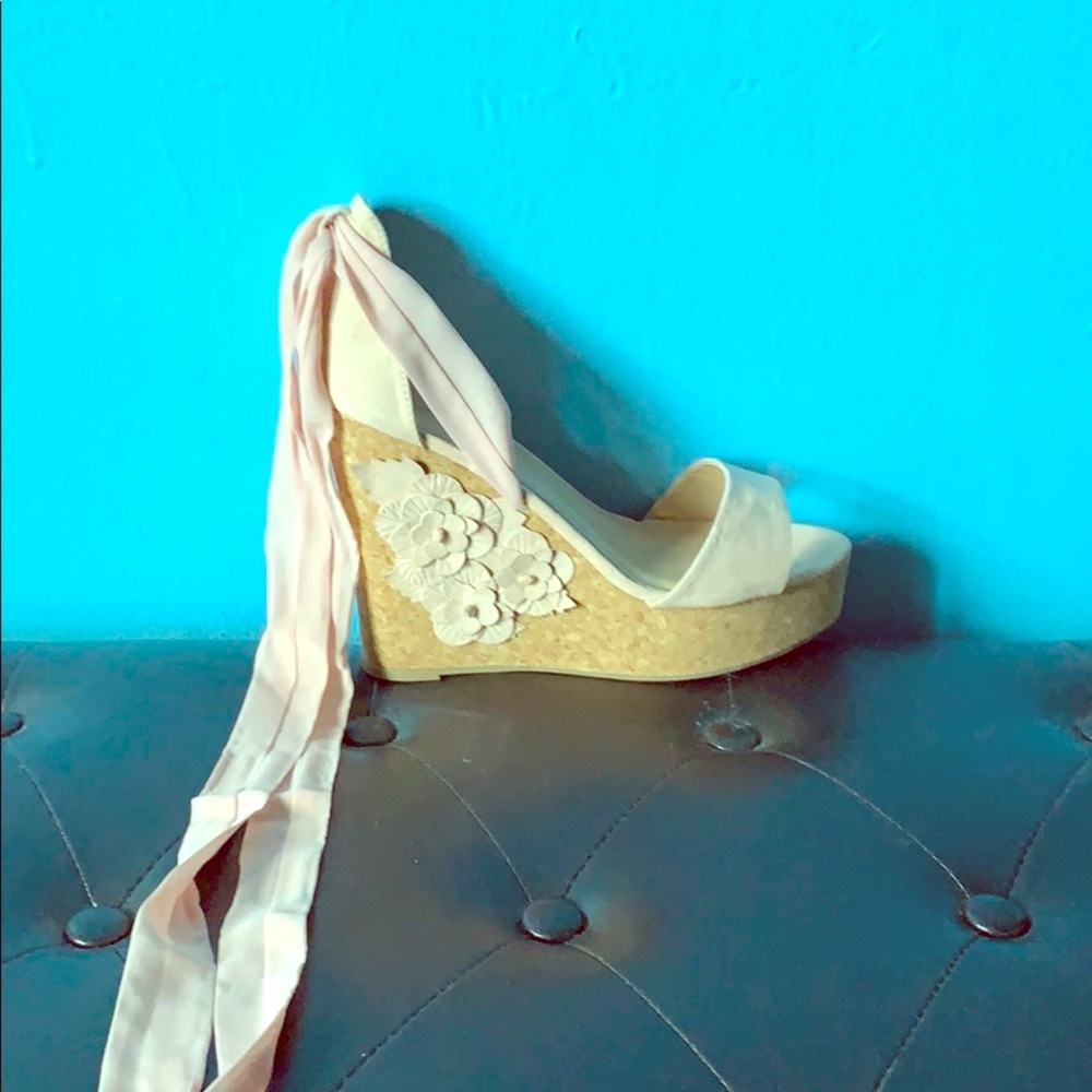 I am selling pretty pink and cream wedges.